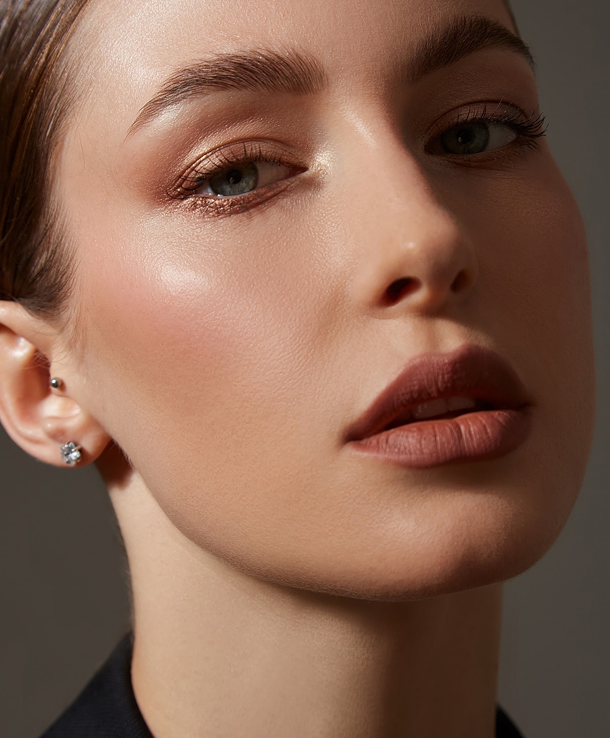 Close-up of a woman’s face with makeup.