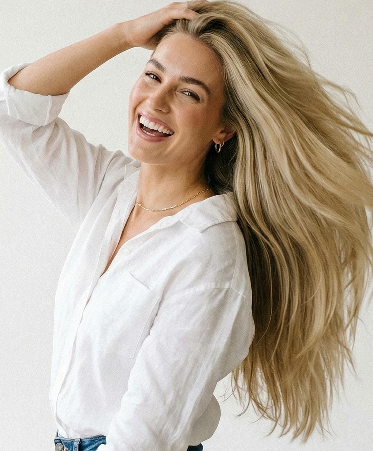 Smiling woman with long blonde hair.