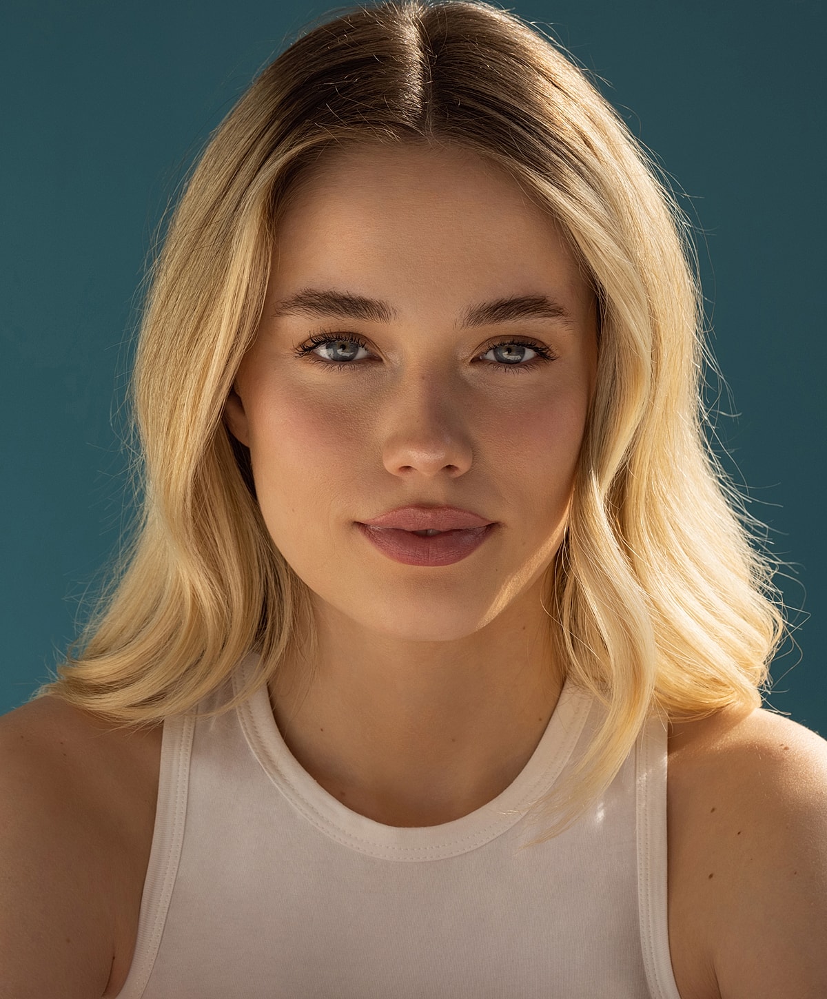 Portrait of a woman with blonde hair.